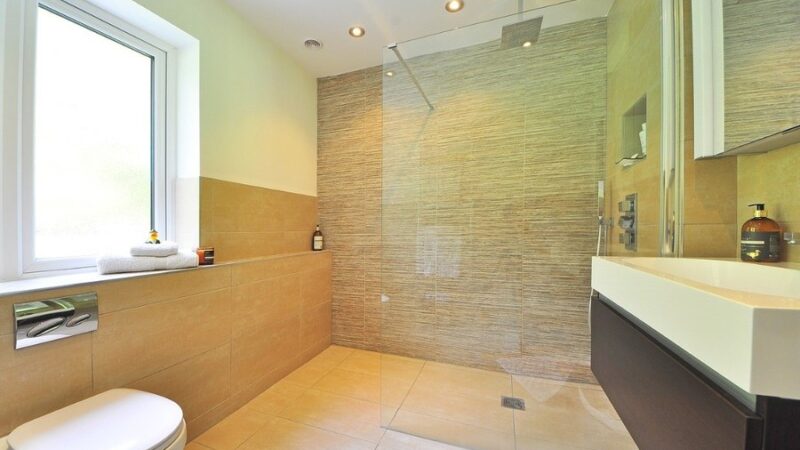 Linear Drainage Solutions and Tiles that Create the Seamless Bathroom Effect